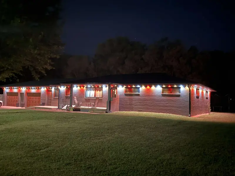 Long ranch home with warm white lights